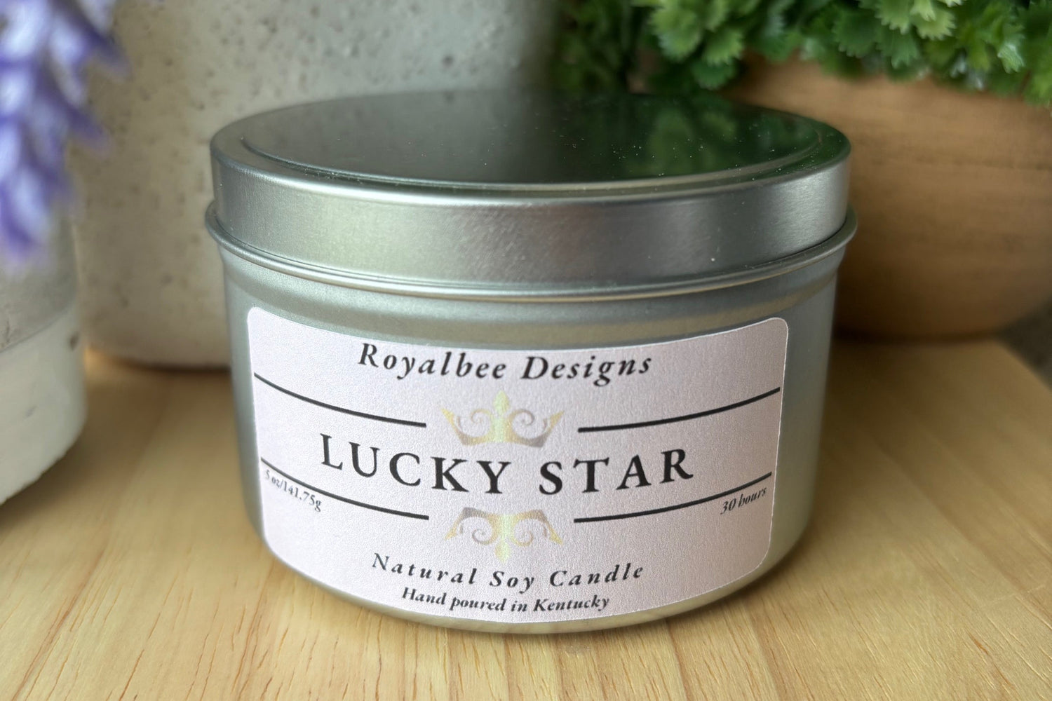 Candle tin labeled 'Lucky Star' by Royalbee Designs background.