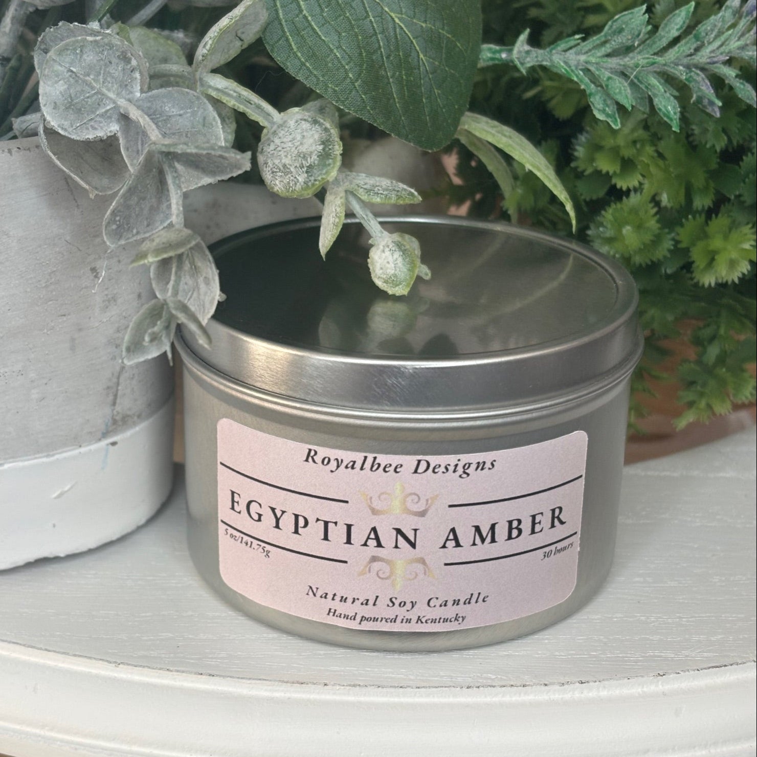 Candle tin labeled 'Egyptian Amber' sold by Royalbee Designs