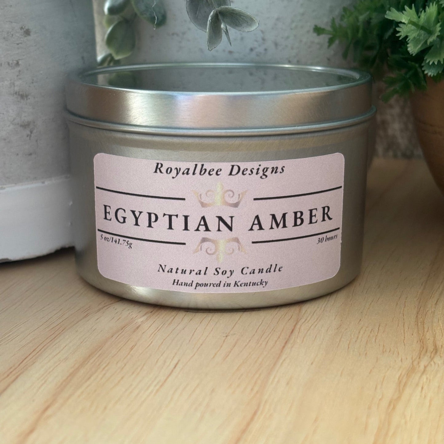 Candle tin labeled 'Egyptian Amber' by Royalbee Designs 