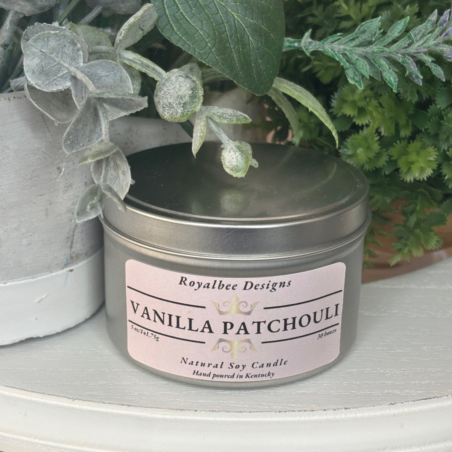 Vanilla patchouli candle in a tin sold by Royalbee Designs