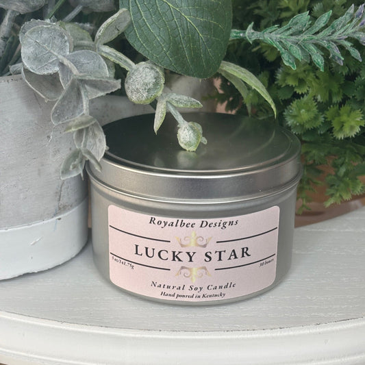 Candle in a tin labeled 'Lucky Star'  sold by Royalbee Designs
