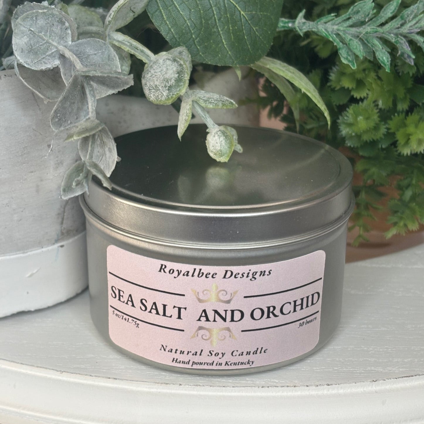Candle jar labeled 'Sea Salt and Orchid' sold by Royalbee Designs