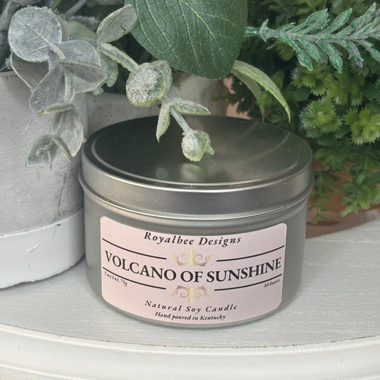 Candle in a tin labeled 'Volcano of Sunshine' sold by Royalbee Designs